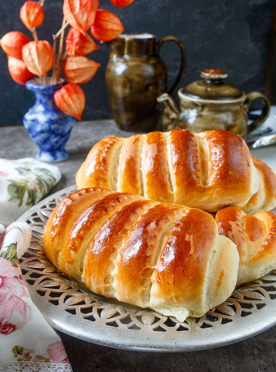 Golden homemade pies beside a teapot